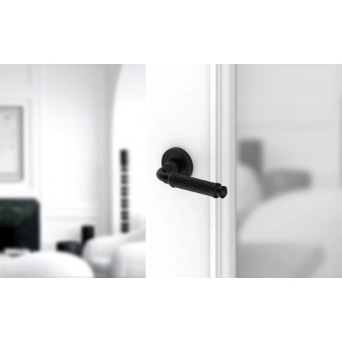 Klamka Aria R CL czarna na rozecie okrągłej Corona