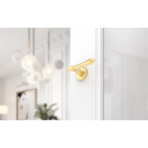 Klamka Century R CL mosiądz błyszczący PVD na rozecie okrągłej Corona